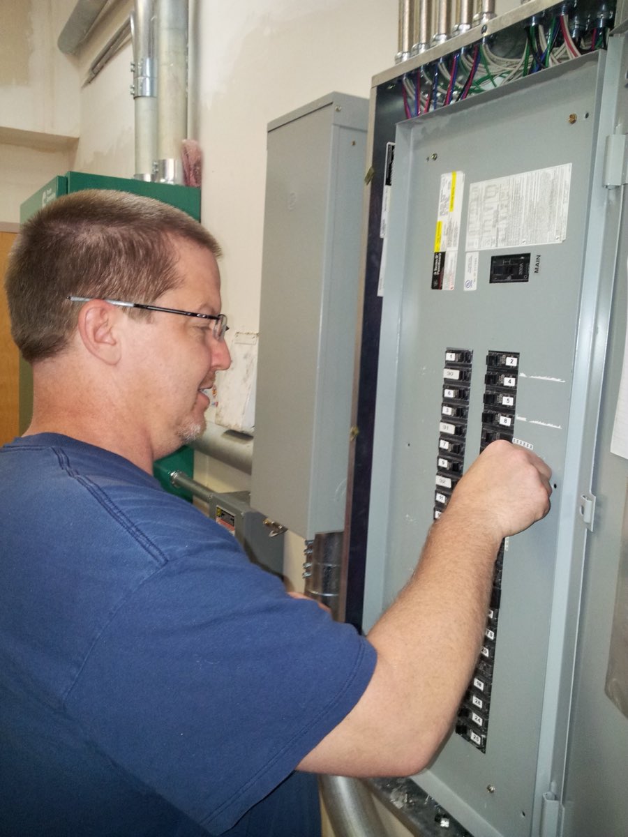 Shane of Alabama Electrical Service working on a service panel
