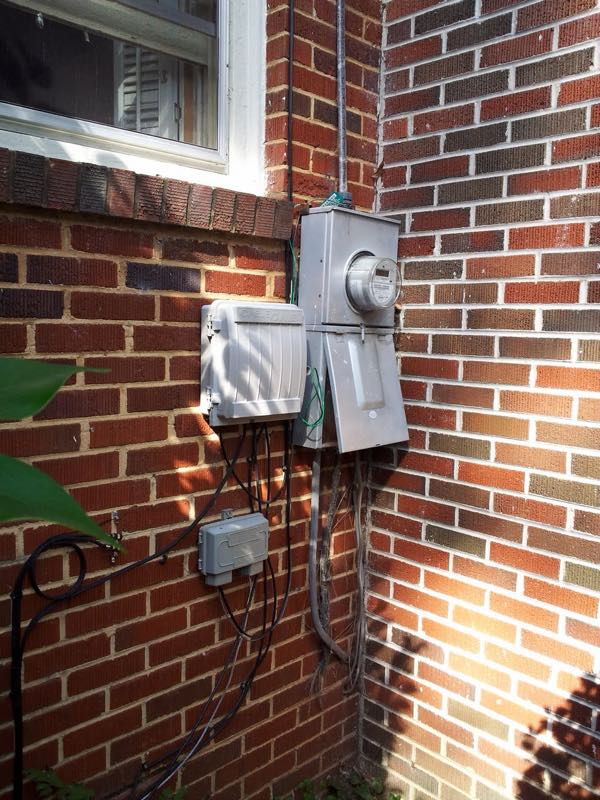 Exterior electrical meter and service on a brick home